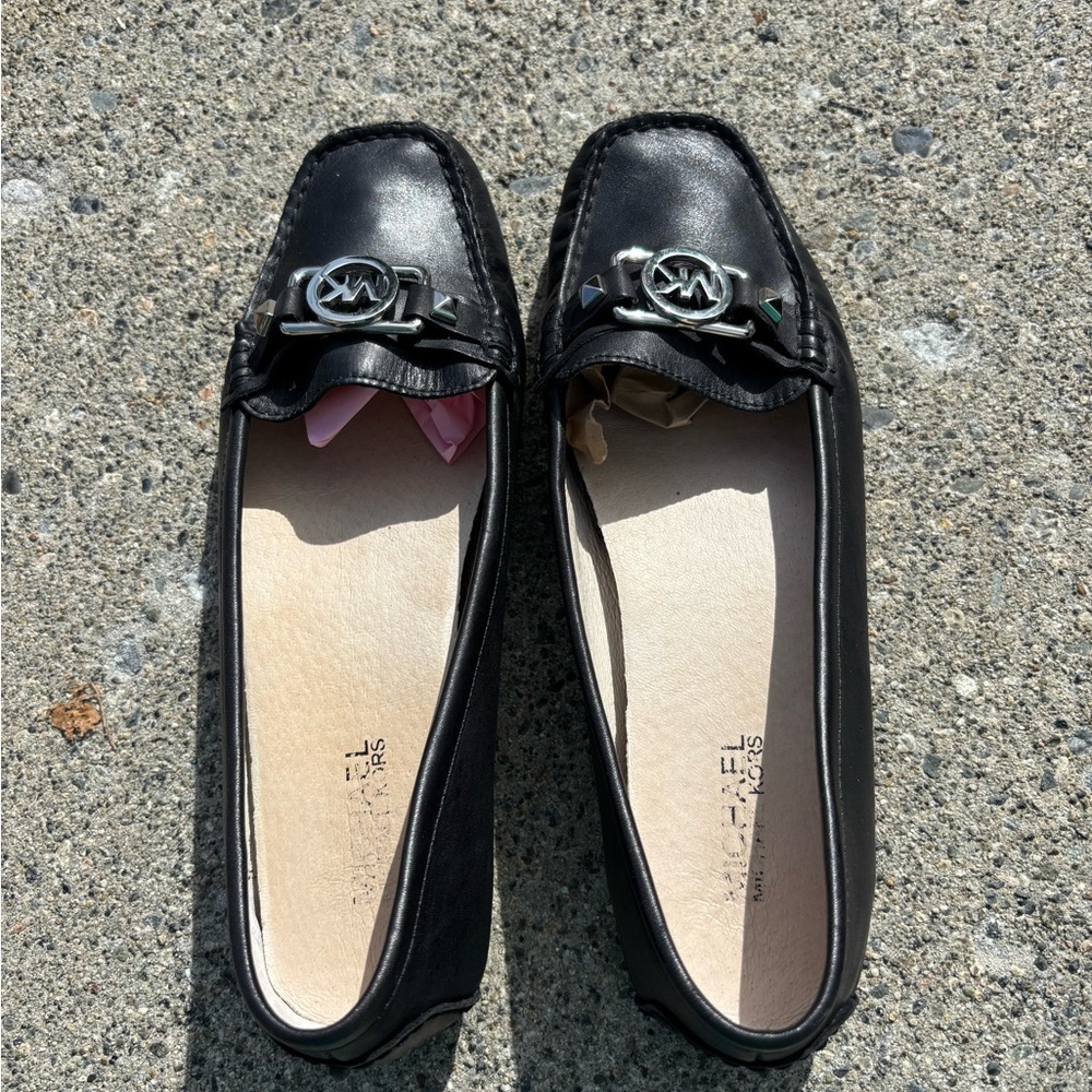Michael Kors black leather loafers with chrome buckle, 9.5
